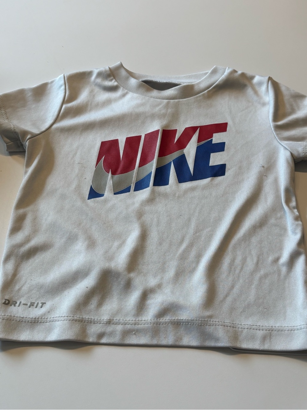 Nike White Kids Dri-FIT Tee with Red and Blue Logo